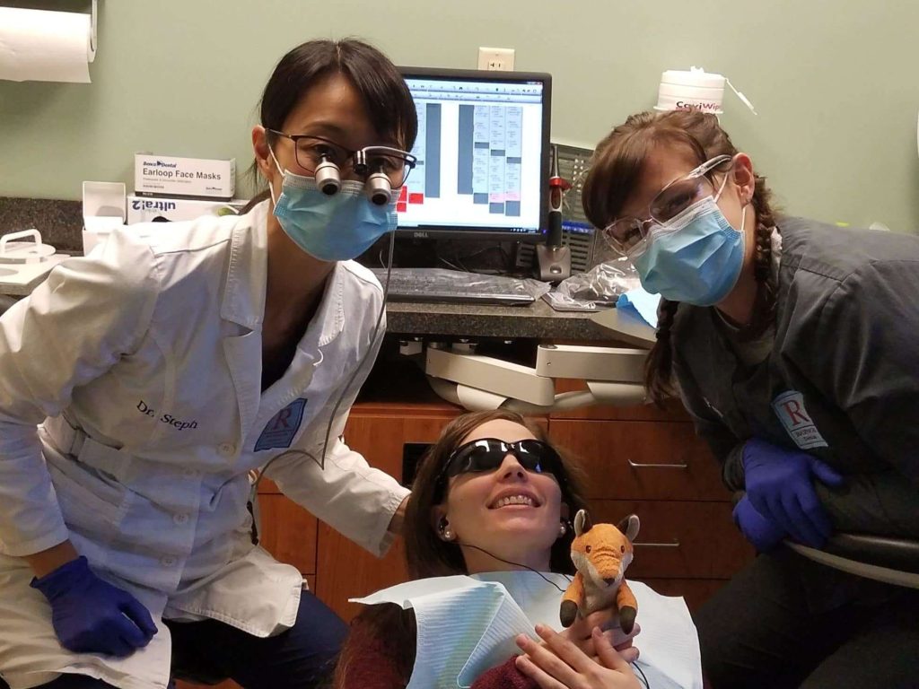 A patient receiving treatment from Dr. Stephanie Raynor during Free Dental Day.